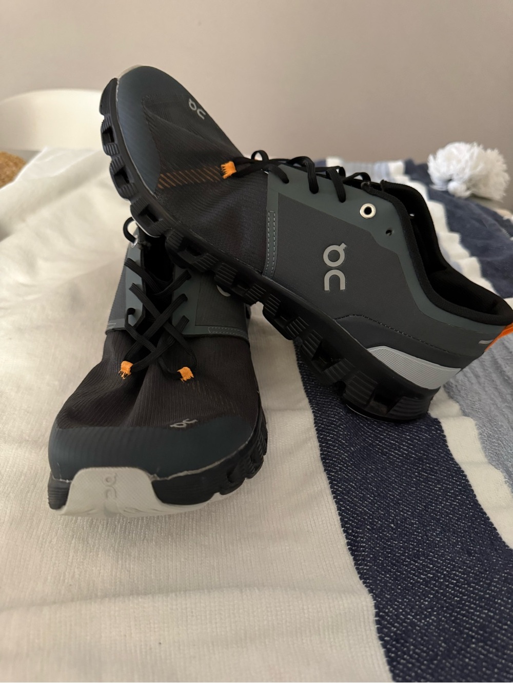 On Running Men's Athletic Shoes in Black, Gray and Orange Accents